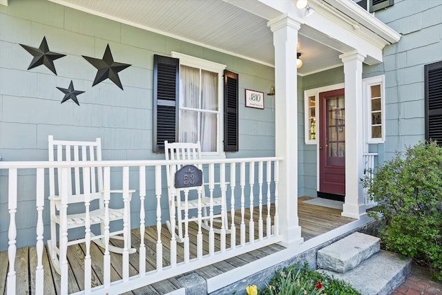 property entrance featuring covered porch