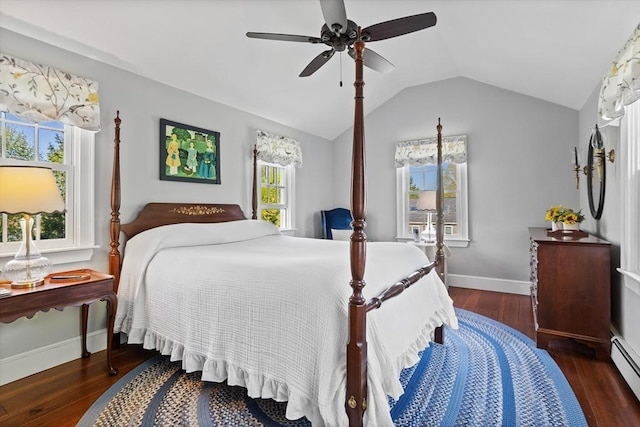 bedroom featuring wood finished floors, lofted ceiling, ceiling fan, and baseboards