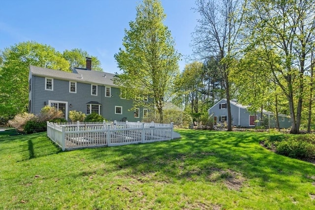 rear view of property with a chimney