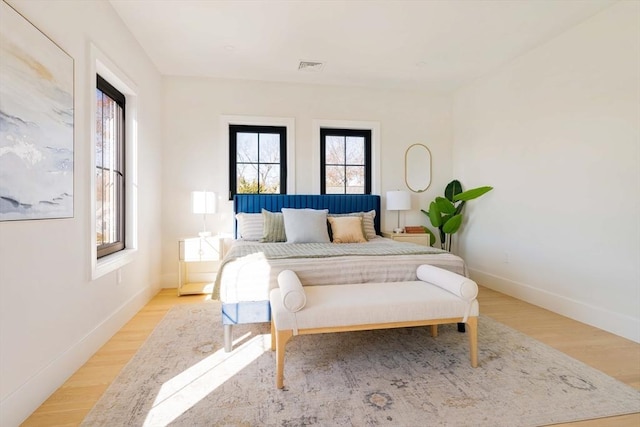 bedroom with light hardwood / wood-style flooring