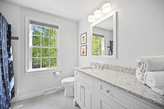full bathroom with toilet, baseboards, vanity, tile patterned floors, and a shower with curtain