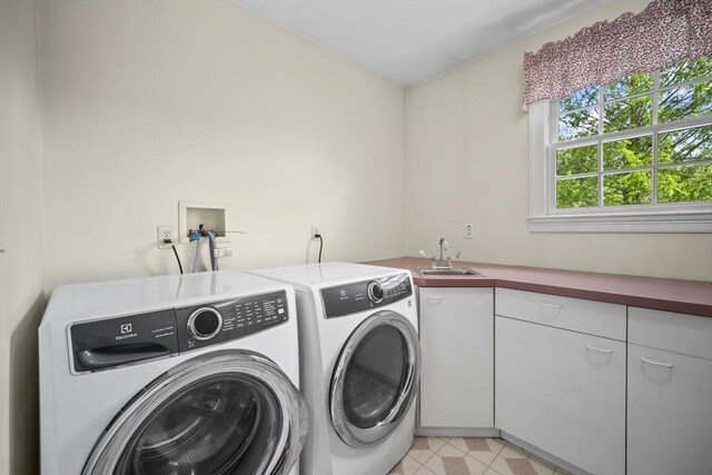 laundry area with cabinet space and washing machine and clothes dryer