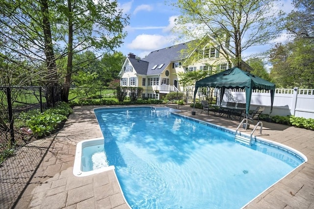 view of swimming pool with a gazebo, a fenced backyard, and a patio