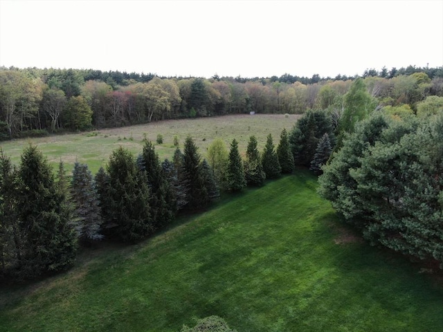view of green lawn with a view of countryside
