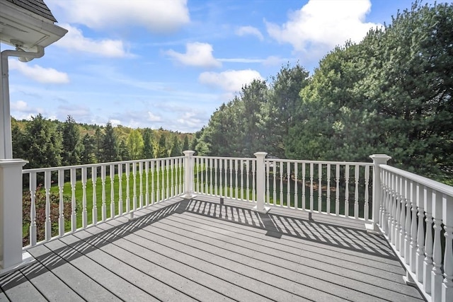 deck featuring a forest view