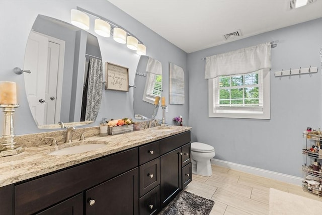 27 Nadias Way, Brockton, MA 02301 - bathroom with double vanity, toilet, and baseboards