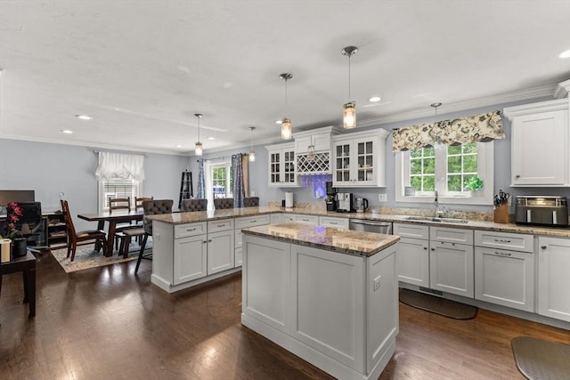 27 Nadias Way, Brockton, MA 02301 - kitchen with a sink, a peninsula, dishwasher, ornamental molding, and glass insert cabinets