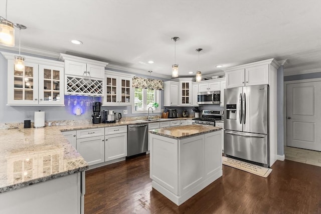 27 Nadias Way, Brockton, MA 02301 - kitchen featuring appliances with stainless steel finishes, light stone counters, ornamental molding, white cabinets, and recessed lighting