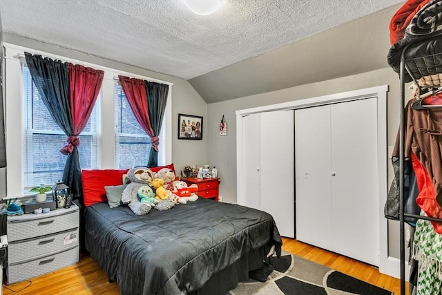 38 Cliff St, Fitchburg, MA 01420 - bedroom with light wood finished floors, a textured ceiling, lofted ceiling, and a closet