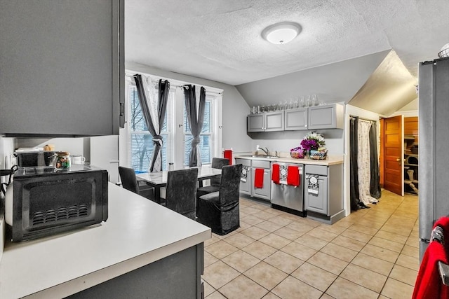 38 Cliff St, Fitchburg, MA 01420 - kitchen featuring gray cabinetry, black microwave, light countertops, vaulted ceiling, and dishwasher