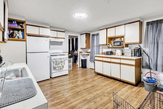 38 Cliff St, Fitchburg, MA 01420 - kitchen with white appliances, under cabinet range hood, white cabinetry, and a sink