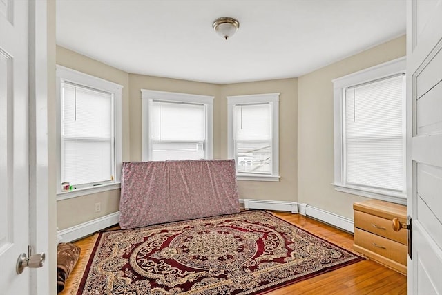 38 Cliff St, Fitchburg, MA 01420 - sitting room featuring wood finished floors, baseboards, and a baseboard radiator