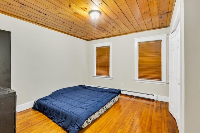 38 Cliff St, Fitchburg, MA 01420 - bedroom featuring a baseboard heating unit, baseboards, wooden ceiling, and hardwood / wood-style flooring