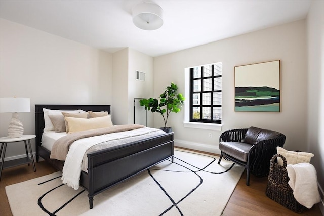 bedroom with light hardwood / wood-style flooring