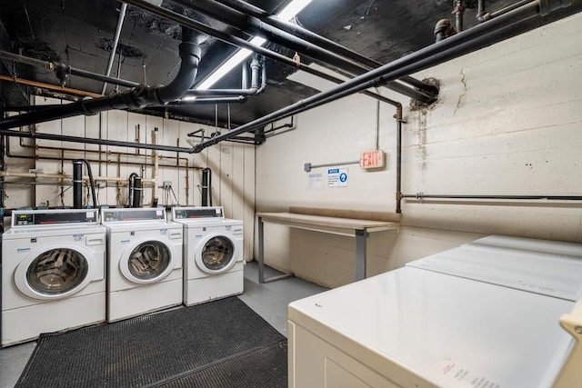 washroom with washing machine and clothes dryer