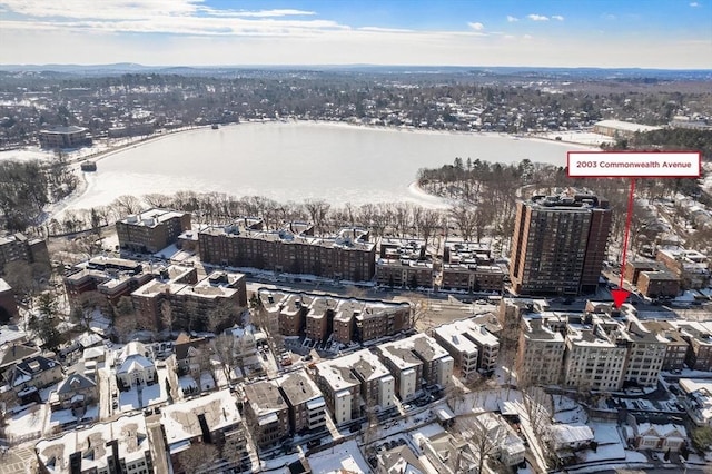 birds eye view of property with a water view and a view of city