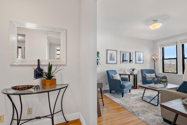 interior space featuring wood finished floors and baseboards