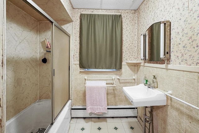 19 Chester St, Fitchburg, MA 01420 - bathroom with tile patterned floors, a wainscoted wall, wallpapered walls, a sink, and bath / shower combo with glass door