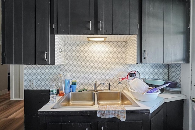 19 Chester St, Fitchburg, MA 01420 - kitchen featuring dark cabinetry, a sink, light countertops, and wood finished floors