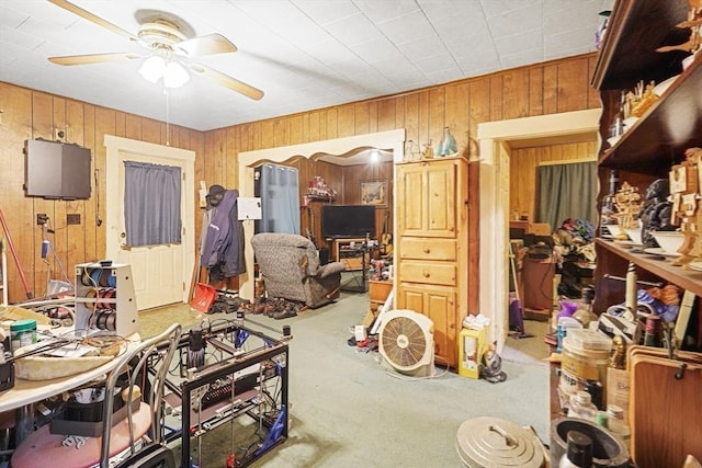 19 Chester St, Fitchburg, MA 01420 - living room featuring a ceiling fan, wooden walls, and carpet