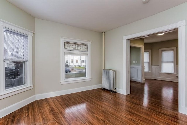 67 Alexander St, Springfield, MA 01107 - spare room with radiator, wood finished floors, and a smoke detector