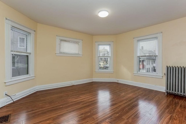 67 Alexander St, Springfield, MA 01107 - empty room with radiator and wood finished floors