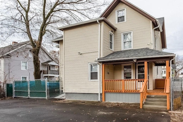 67 Alexander St, Springfield, MA 01107 - view of front of house with covered porch and a gate