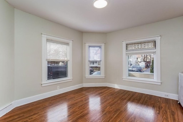 67 Alexander St, Springfield, MA 01107 - empty room featuring wood finished floors and radiator