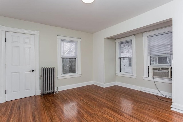 67 Alexander St, Springfield, MA 01107 - spare room with radiator, wood finished floors, and cooling unit