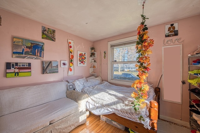 bedroom featuring wood-type flooring