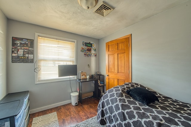 bedroom featuring dark hardwood / wood-style floors