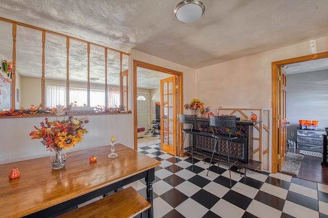 dining area featuring a textured ceiling