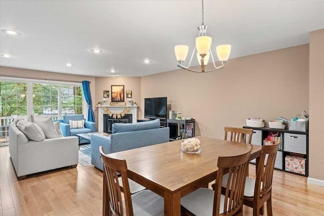 U505 Browning Ln # 505, Worcester, MA 01609 - dining room featuring light wood finished floors, a chandelier, a fireplace, and recessed lighting