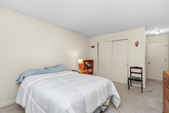 56 Jacqueline Rd Unit 12, Waltham, MA 02452 - bedroom featuring light colored carpet and a closet