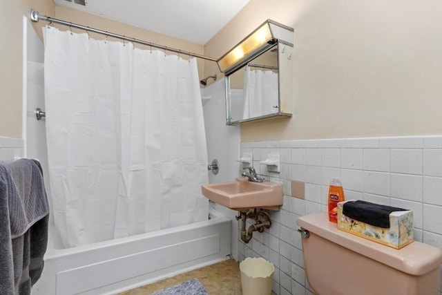 56 Jacqueline Rd Unit 12, Waltham, MA 02452 - full bath featuring tile walls, shower / bathtub combination with curtain, and wainscoting