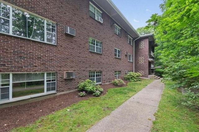 56 Jacqueline Rd Unit 12, Waltham, MA 02452 - view of side of home with brick siding