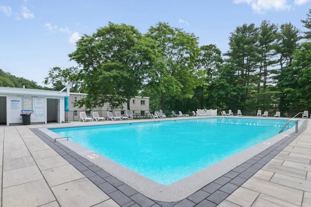56 Jacqueline Rd Unit 12, Waltham, MA 02452 - community pool featuring a patio