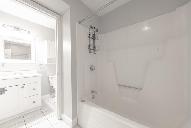 full bathroom with baseboards, shower / washtub combination, toilet, vanity, and tile patterned flooring