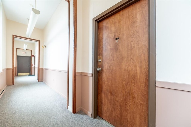corridor featuring light carpet