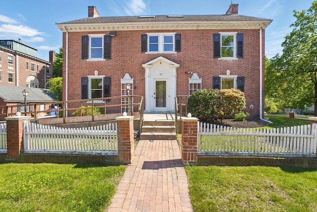 6 Windsor St, Andover, MA 01810 - colonial-style house with a chimney and brick siding