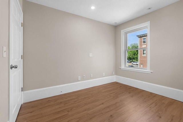 6 Windsor St, Andover, MA 01810 - empty room with wood finished floors and recessed lighting