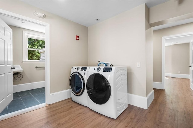 6 Windsor St, Andover, MA 01810 - laundry room with washer and dryer and wood finished floors