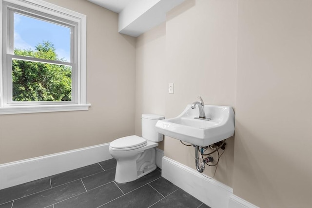 6 Windsor St, Andover, MA 01810 - bathroom with baseboards and tile patterned floors
