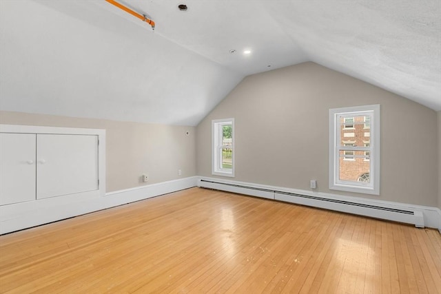 6 Windsor St, Andover, MA 01810 - bonus room featuring baseboard heating, hardwood / wood-style floors, and lofted ceiling