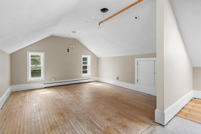 6 Windsor St, Andover, MA 01810 - bonus room featuring baseboard heating, hardwood / wood-style flooring, and lofted ceiling