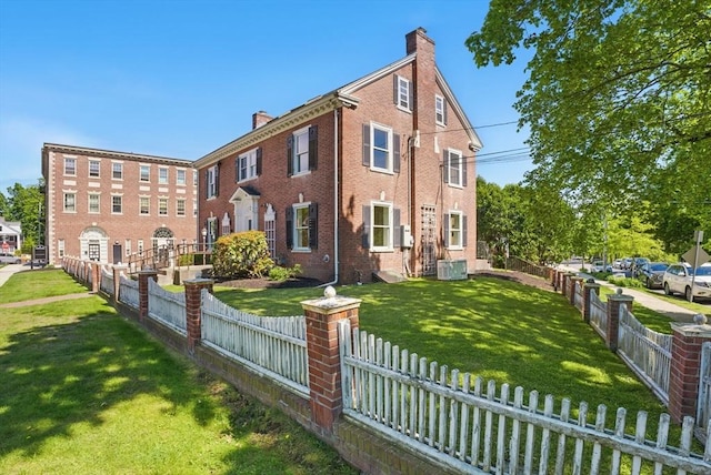 6 Windsor St, Andover, MA 01810 - view of front facade with a chimney and brick siding