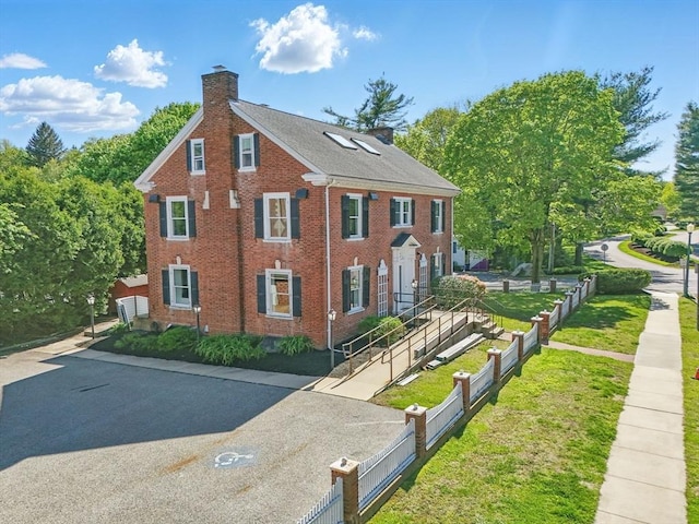 6 Windsor St, Andover, MA 01810 - view of front of home with a chimney and brick siding