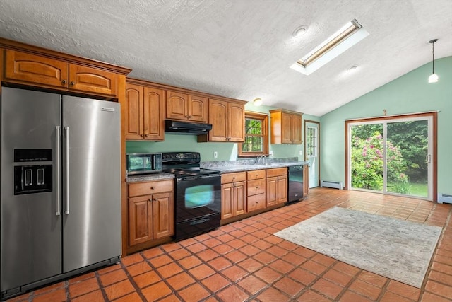 5 Ingalls Rd, Tyngsborough, MA 01879 - kitchen with black appliances, under cabinet range hood, baseboard heating, a skylight, and lofted ceiling