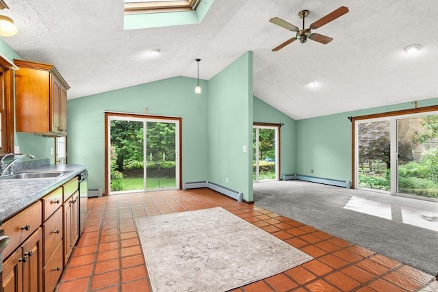 5 Ingalls Rd, Tyngsborough, MA 01879 - kitchen featuring baseboard heating, a baseboard radiator, vaulted ceiling, a ceiling fan, and a skylight