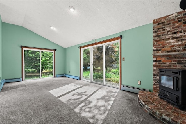 5 Ingalls Rd, Tyngsborough, MA 01879 - unfurnished living room with a baseboard radiator, a wood stove, lofted ceiling, carpet floors, and a textured ceiling